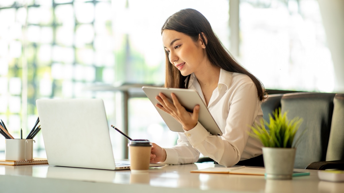 Canadian small business owner using cloud bookkeeping software on a laptop